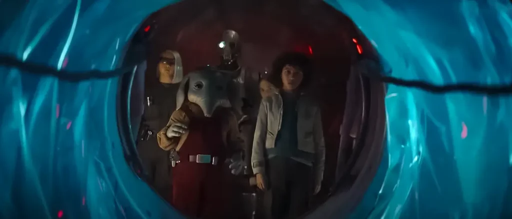 Vier Kinder betreten das Cockpit eines verlassenen Raumschiffs in einer Szene aus Star Wars: Skeleton Crew, entdeckt unter der Erde.