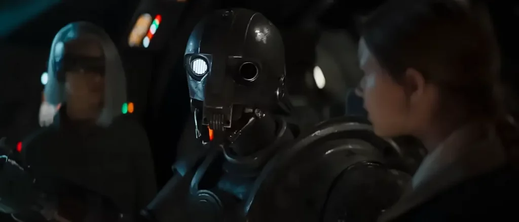 Roboter SM-33 und die Kinder der Skeleton Crew im Cockpit eines Raumschiffs in einer Szene aus Star Wars: Skeleton Crew.